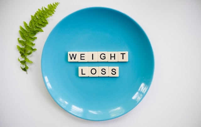 weight loss spelled out on a blue plate