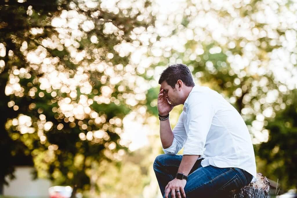 Man suffering from hangover headache