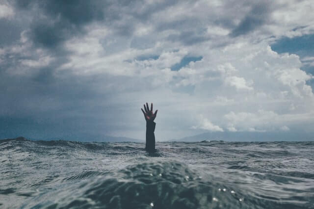 hand up in the ocean