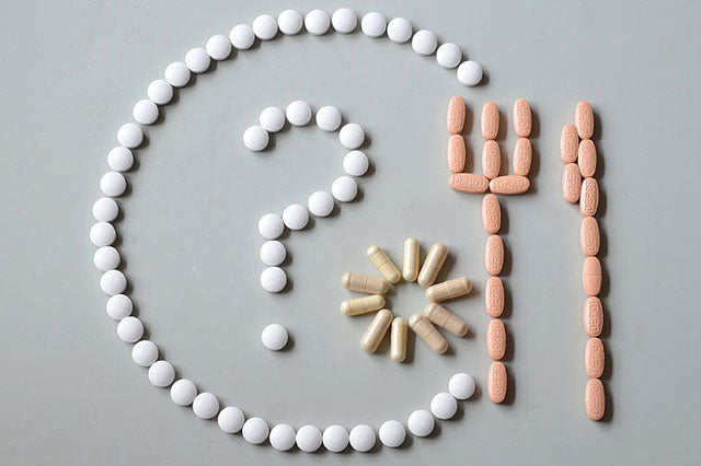 multi-colored detox pills for drug test arranged in geometric shapes