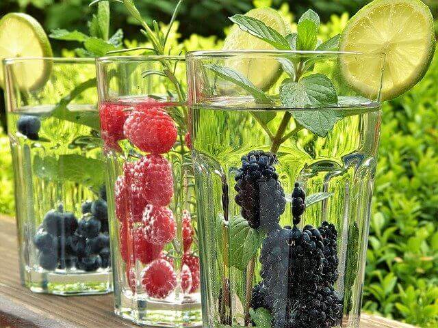 water cups with berries and mint