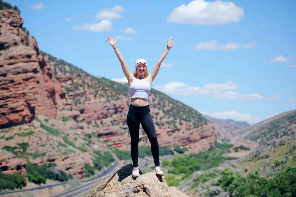 A woman hiking outdoors.